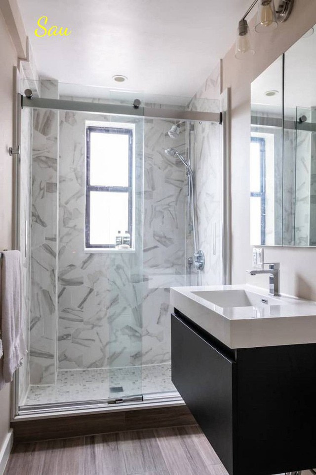 
Phòng tắm được thiết kế lại theo chiều ngang, với cửa kính trong suốt ăn gian diện tích. Sàn gỗ dày cũng tạo cảm giác ấm cúng và sang trọng hơn.
