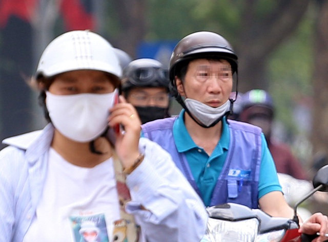 Bất chấp quy định, nhiều người vẫn không thực hiện đeo khẩu trang khi ra đường - Ảnh 7.