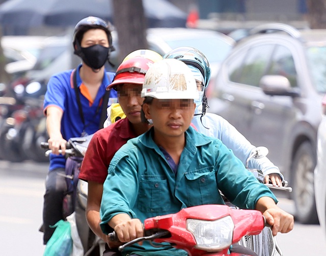 Bất chấp quy định, nhiều người vẫn không thực hiện đeo khẩu trang khi ra đường - Ảnh 14.