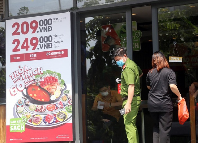 Hà Nội phong tỏa quán pizza số 106 Trần Thái Tông - Ảnh 9.