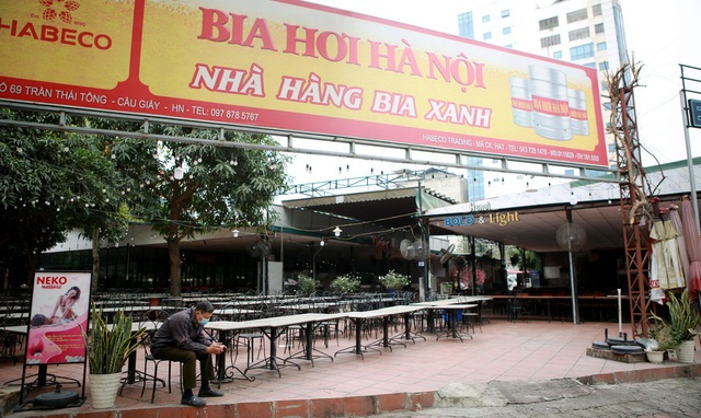 Nhà hàng, quán nhậu Hà Nội vắng không một bóng người, ngậm ngùi đồng loạt treo biển nghỉ Tết sớm - Ảnh 10.