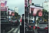 Nhân viên IT phát cảnh nóng lên biển quảng cáo trung tâm Jakarta Nhân viên IT phát cảnh nóng lên biển quảng cáo trung tâm Jakarta