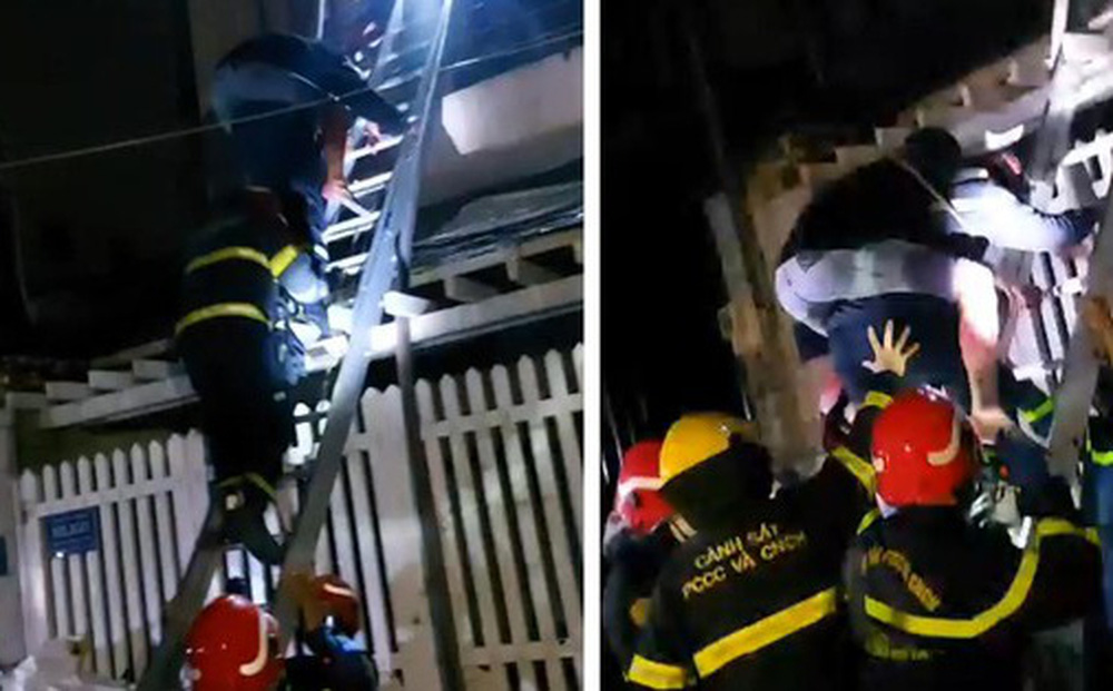 Cảnh s&aacute;t leo thang, c&otilde;ng người tho&aacute;t khỏi đ&aacute;m ch&aacute;y nh&agrave; l&uacute;c rạng s&aacute;ng - Ảnh 1.