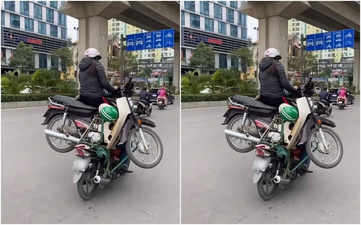 Hai xe máy &quot;làm xiếc&quot; trên đường phố Hà Nội - Ảnh 1.