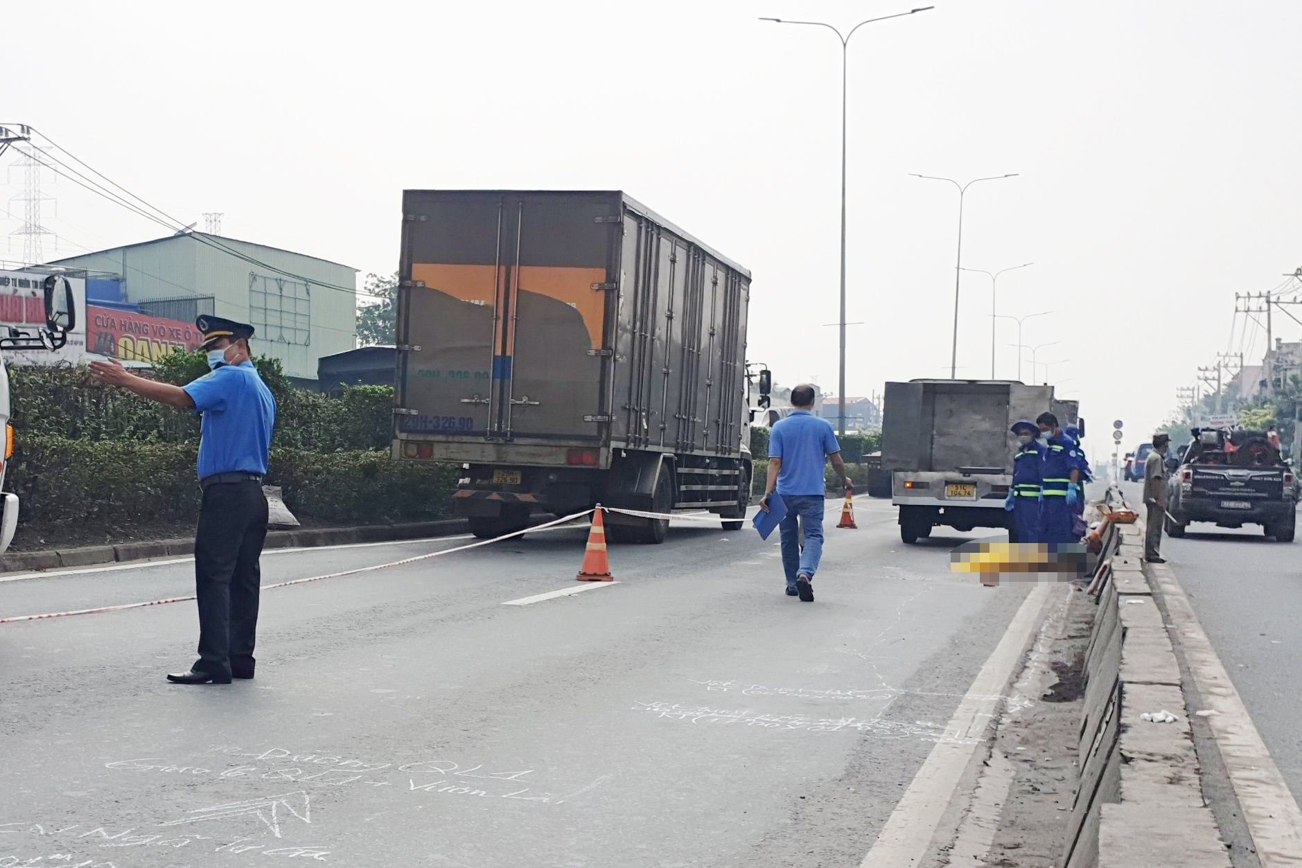 Hai vợ chồng bị xe cán tử vong ở TP.HCM - Ảnh 1. Hai vợ chồng bị xe cán tử vong ở TP.HCM - Ảnh 1.