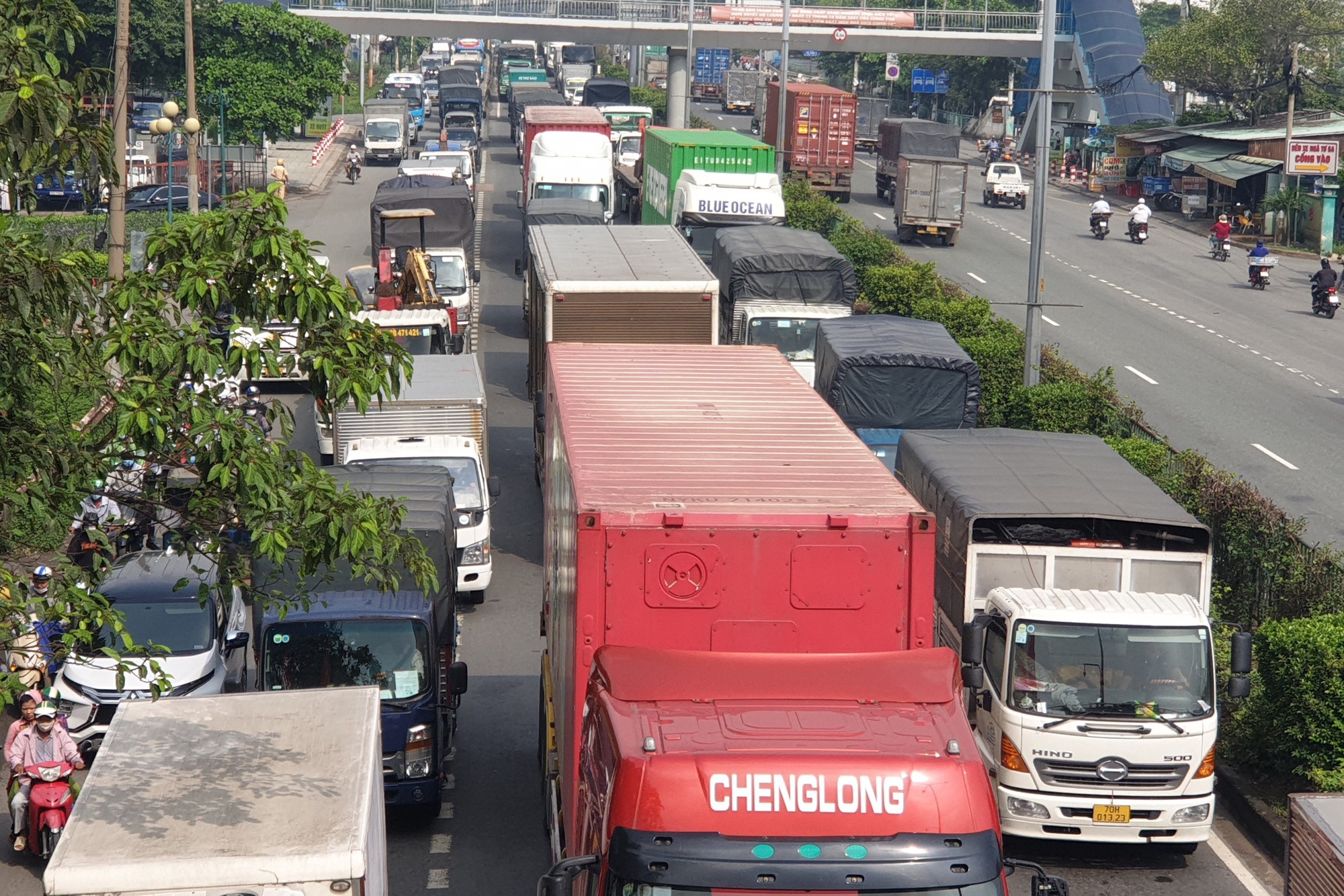 Hai vợ chồng bị xe cán tử vong ở TP.HCM - Ảnh 2. Hai vợ chồng bị xe cán tử vong ở TP.HCM - Ảnh 2.