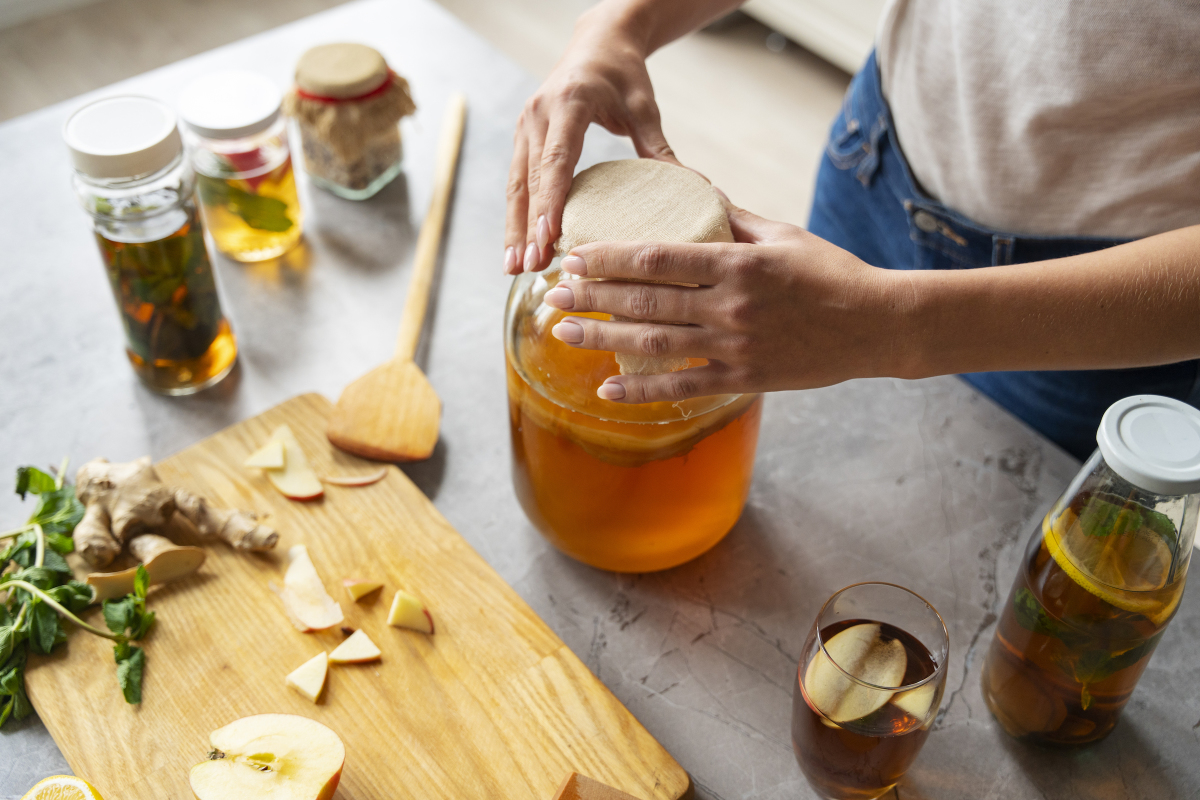 high-angle-woman-preparing-kombucha-1696893709-1731894935430-17318949356071000151840.jpg