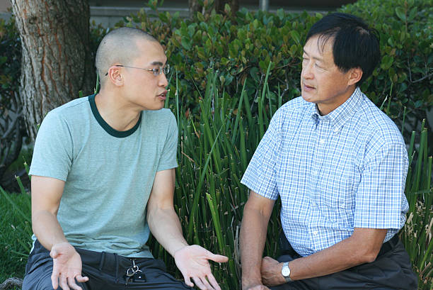 father-and-son-talking-in-a-garden-17072991960121798349059-1736323445703-17363234458321269014831.jpg