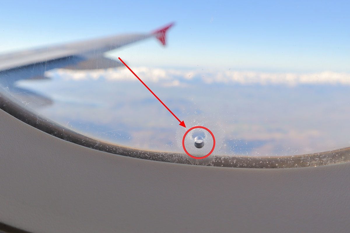 why-do-airplane-windows-have-a-tiny-hole-in-themgettyimages-2171660473ft-093247-1775089494946-17750894951281724151520.jpg