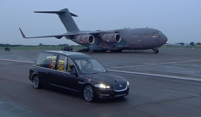 62369425-11206755-the-raf-jet-in-the-background-as-the-state-hearse-carries-the-qu-a-83-1663100424945-1663109410-16631260899001151263329.jpg