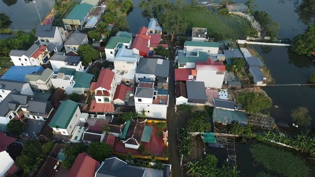 Hiện trạng cuộc sống người d&acirc;n th&ocirc;n ven s&ocirc;ng T&iacute;ch sau 1 tuần ngập lũ 2026 - Ảnh 11.