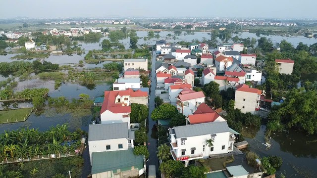 Hiện trạng cuộc sống người d&acirc;n th&ocirc;n ven s&ocirc;ng T&iacute;ch sau 1 tuần ngập lũ 2026 - Ảnh 2.