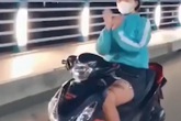 Lộ danh tính cô gái đi xe máy thả 2 tay múa quạt gây bức xúc dư luận Lộ danh tính cô gái đi xe máy thả 2 tay múa quạt gây bức xúc dư luận