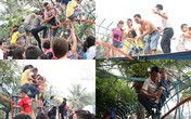 Phụ huynh ôm con leo rào: Để con vui là chính! Phụ huynh ôm con leo rào: Để con vui là chính!