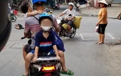 Bố chở con đi chơi bằng xe máy, nhưng vị trí ngồi của 2 đứa nhỏ khiến cả khu phố bất an Bố chở con đi chơi bằng xe máy, nhưng vị trí ngồi của 2 đứa nhỏ khiến cả khu phố bất an