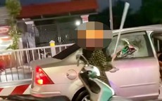 Lý do bất ngờ người phụ nữ tạt đầu ô tô, đập bể kính xe trên phố