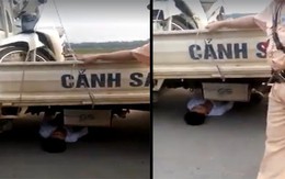 Bị tạm giữ xe do vi phạm giao thông, nam thanh niên chui vào gầm xe ôtô CSGT "ăn vạ"
