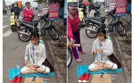Cô gái xinh đẹp ngồi giữa đường xin tiền về Hà Nội