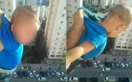 Bé trai bị người thân treo ngoài cửa sổ tầng 15 để 'câu' like Facebook