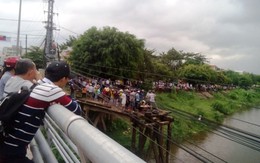 Thanh niên sảy chân rơi sông khi đứng xem tìm kiếm thi thể nhảy cầu
