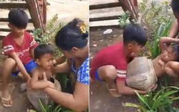 Mẹ loay hoay giải cứu con trai mắc kẹt trong chum