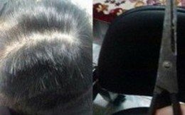 Bất chấp con trai 10 tuổi đứng trước mặt, chồng vẫn đánh đập và cắt trọc đầu vợ