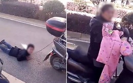 Mẹ trói tay con trai vào xe máy kéo lê trên đường vì tội nghịch