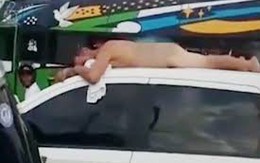 Bắt chồng trần truồng nằm trên nóc xe vì ngoại tình