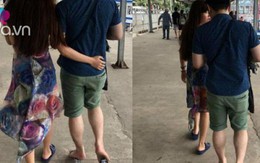 Bức ảnh chụp phía sau đôi vợ chồng, tưởng bình thường nhưng lại chứa điều ngang trái
