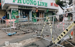 Người Sài Gòn chui hàng rào thép gai để giao hàng vì chốt chặn một số nơi chưa được tháo gỡ