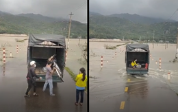 Khoảnh khắc ấm áp: Tài xế xe tải giúp đưa bé gái đi xe đạp vượt dòng lũ dữ an toàn
