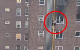 Thót tim cảnh 2 chị em thoát khỏi tòa nhà cháy bằng cách đu bám đường ống nước