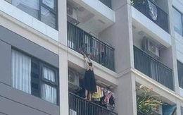 Hà Nội: Giận chồng, vợ treo mình lơ lửng ngoài ban công chung cư cao tầng