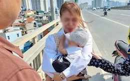 Tài xế giúp đỡ người mẹ ôm con nhỏ khóc trên cầu Nhật Tân và cái kết có hậu