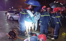 Huy động cảnh sát và máy móc để giải cứu người đàn ông thụt chân vào nắp cống bê tông