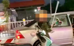 Lý do bất ngờ người phụ nữ tạt đầu ô tô, đập bể kính xe trên phố