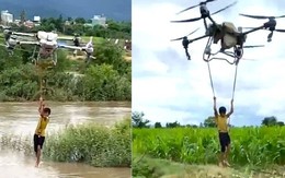 Nghẹt thở pha dùng drone hạng nặng giải cứu 2 bé mắc kẹt giữa dòng nước xiết