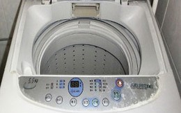 Giải cứu bé 7 tuổi kẹt trong máy giặt