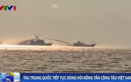 Sáng sớm, tàu Trung Quốc đã xịt vòi rồng