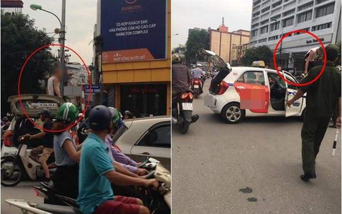 Tài xế taxi leo lên nóc xe "ăn vạ" khi bị CSGT Hà Nội dừng xe