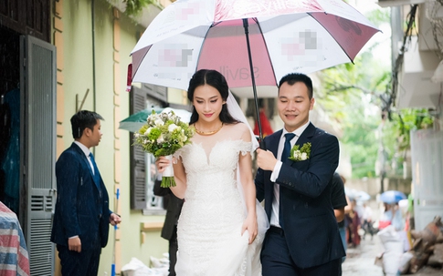 Á hậu Đại dương 2014 được chồng hơn 9 tuổi che mưa trong lễ rước dâu