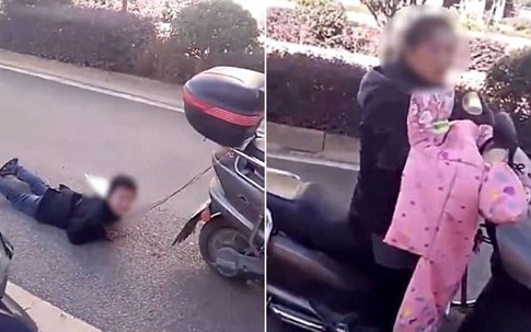 Mẹ trói tay con trai vào xe máy kéo lê trên đường vì tội nghịch