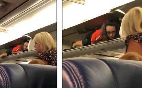 Đang ngồi trên máy bay, hành khách giật thót mình khi tiếp viên hàng không hành động lạ, chui vào hộc hành lý nằm