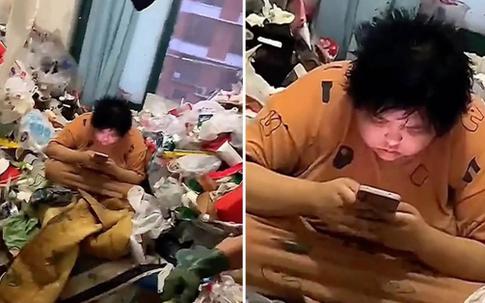 Cảnh sống 'ăn lông ở lỗ' của cô gái trong căn hộ thối hoắc, rác chất lên tận cửa sổ
